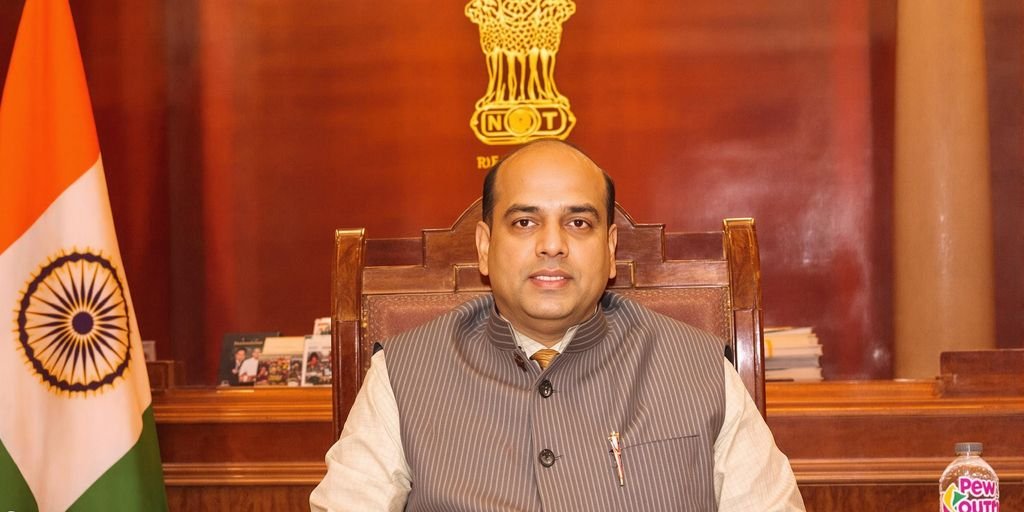Vijender Gupta in formal attire at Delhi Assembly dais.